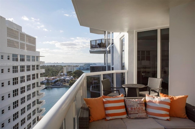 balcony featuring a water view