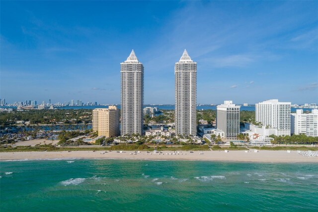 bird's eye view featuring a beach view and a water view