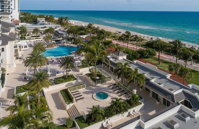 drone / aerial view featuring a water view and a beach view