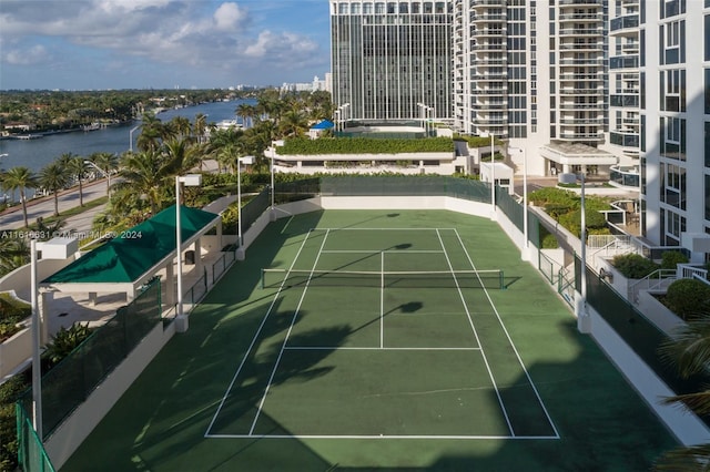 view of sport court featuring a water view