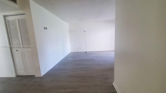 corridor featuring dark hardwood / wood-style flooring