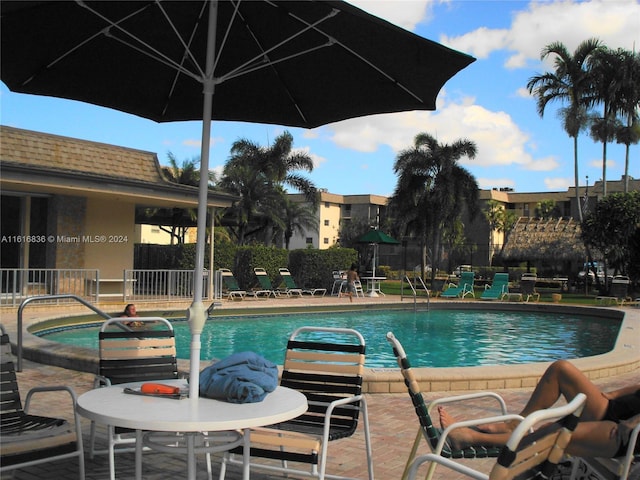 view of pool featuring a patio area and a jacuzzi