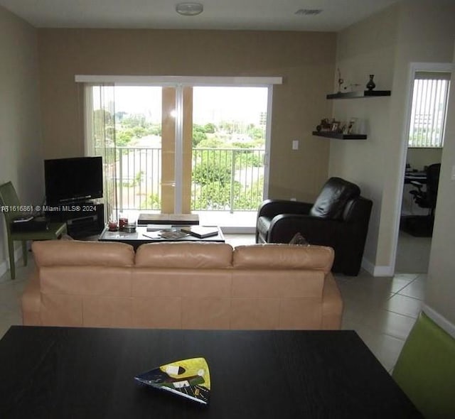 living room with tile patterned floors