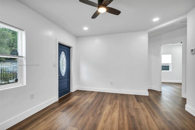 unfurnished room featuring dark hardwood / wood-style flooring and ceiling fan