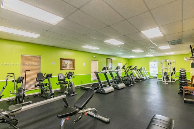 gym featuring a paneled ceiling