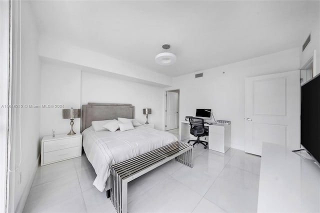 bedroom featuring light tile patterned flooring