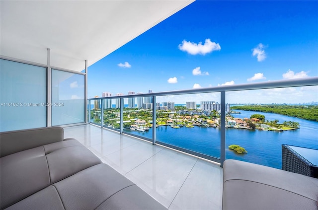 balcony featuring an outdoor hangout area and a water view