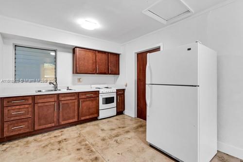 kitchen featuring sink and white appliances