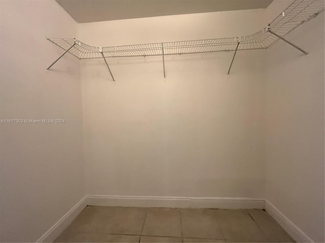 walk in closet featuring tile patterned floors