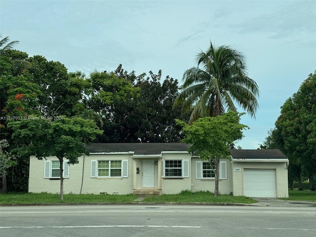 single story home featuring a garage