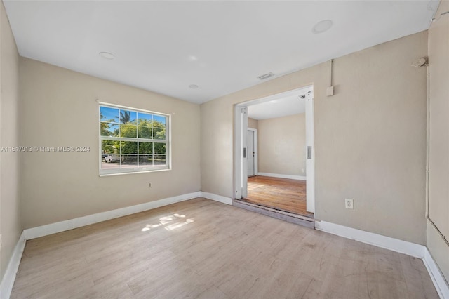 1400 SW 62nd Ave, West Miami, FL 33144 - unfurnished room featuring wood finished floors and baseboards