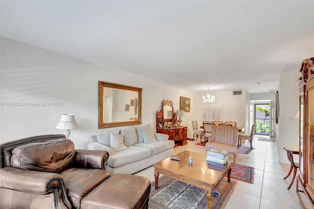 tiled living room featuring a notable chandelier