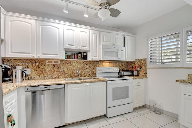 kitchen with ceiling fan, backsplash, light tile patterned floors, white appliances, and white cabinets