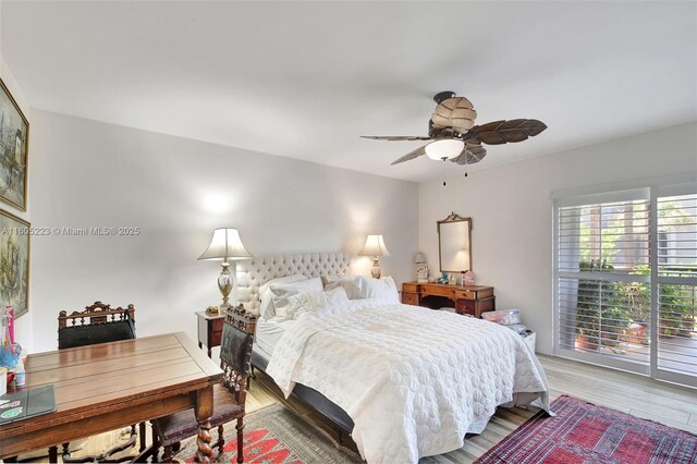 bedroom featuring access to outside, ceiling fan, and hardwood / wood-style flooring