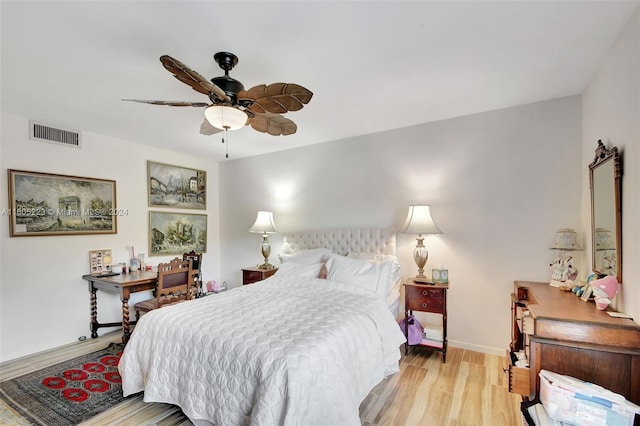 bedroom with ceiling fan and light hardwood / wood-style floors