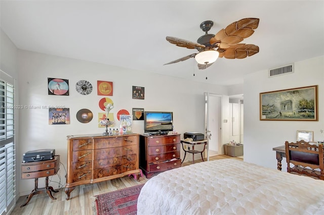 bedroom with light wood-type flooring and ceiling fan