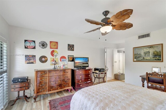 bedroom with light wood-type flooring and ceiling fan