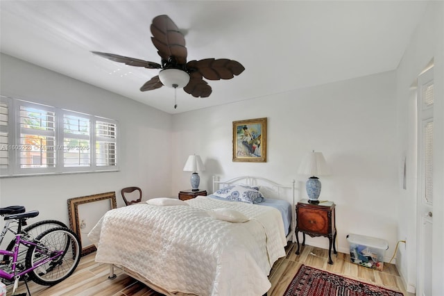 bedroom with ceiling fan and light hardwood / wood-style floors