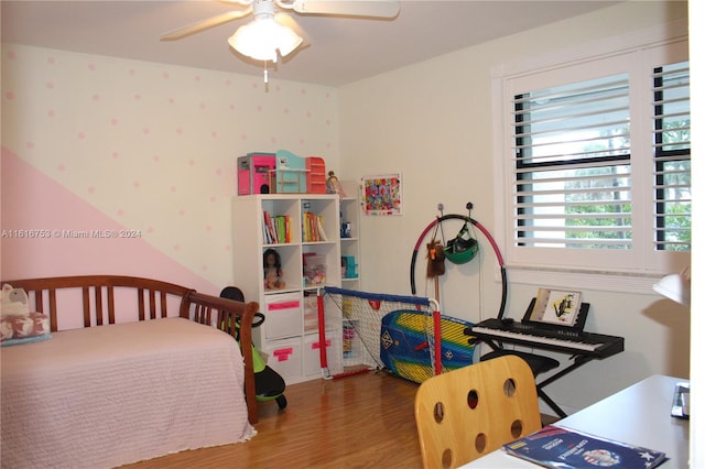 bedroom featuring hardwood / wood-style flooring and ceiling fan