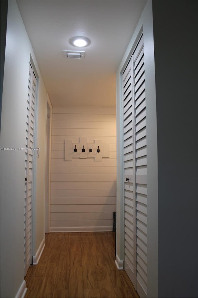 hallway with dark wood-type flooring