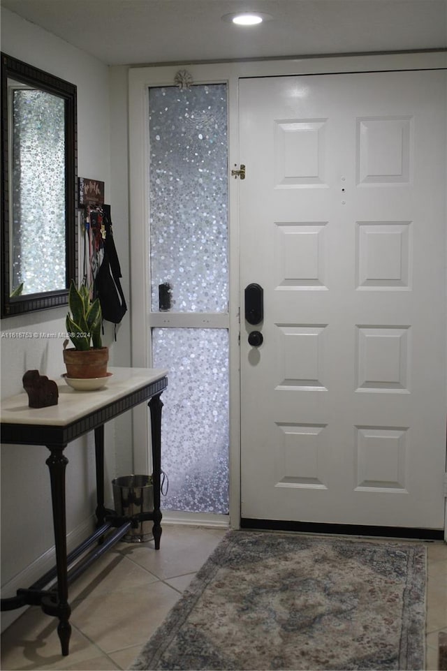 doorway featuring tile patterned flooring