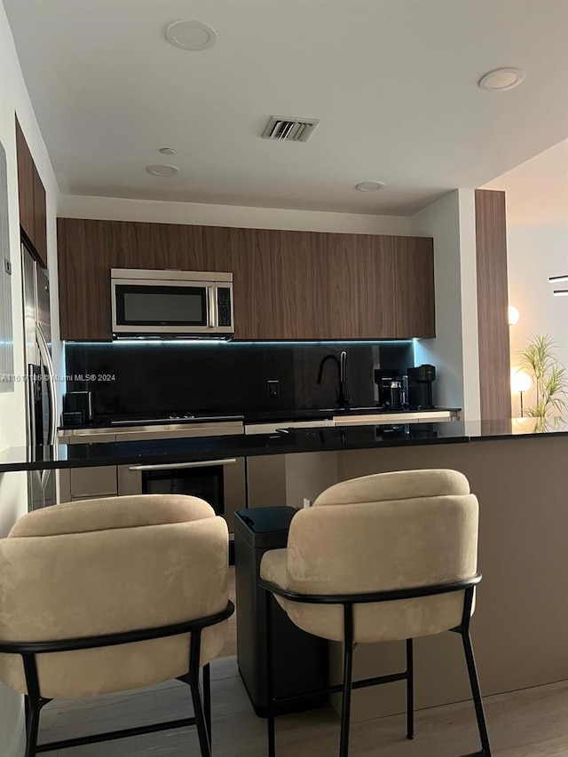 kitchen featuring sink and hardwood / wood-style flooring