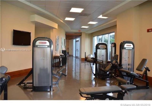 exercise room with a paneled ceiling