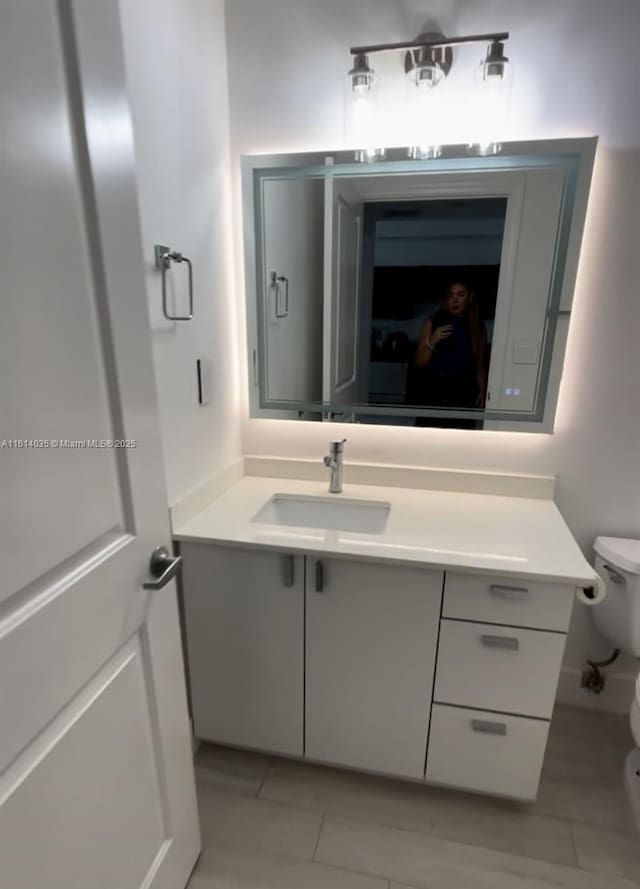 bathroom with vanity and toilet