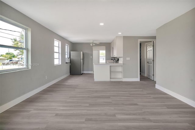 unfurnished living room featuring light hardwood / wood-style floors