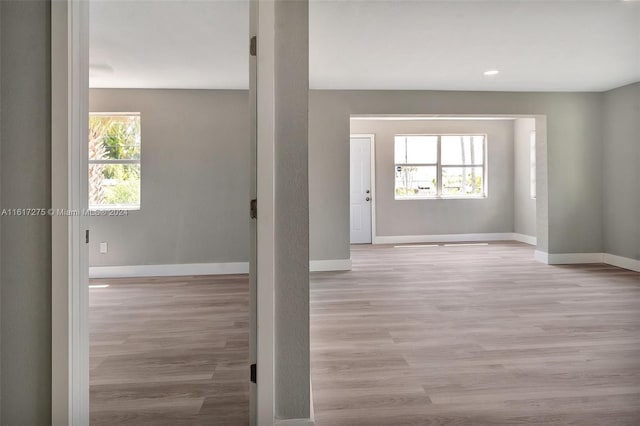 unfurnished room with light hardwood / wood-style flooring