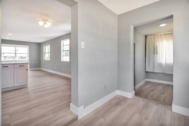 corridor featuring light hardwood / wood-style floors