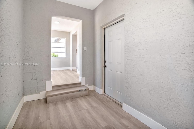 corridor featuring light hardwood / wood-style flooring