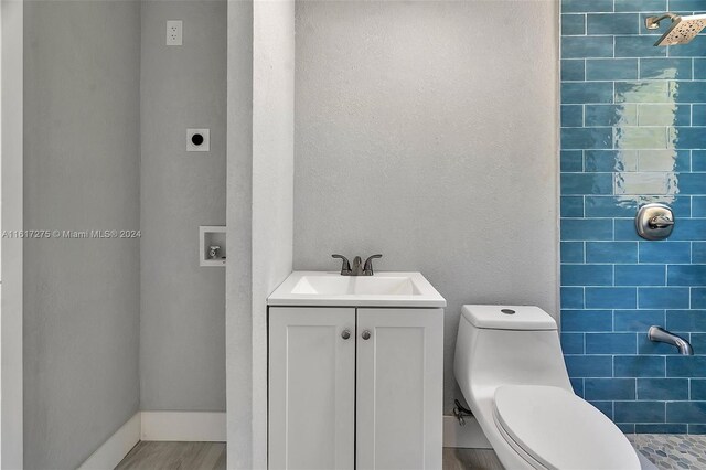 bathroom featuring hardwood / wood-style floors, vanity, and toilet