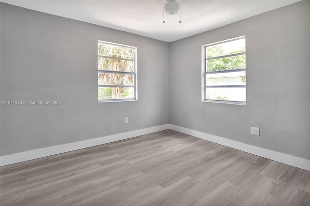 unfurnished room featuring light hardwood / wood-style flooring