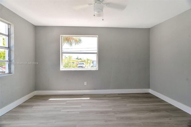 unfurnished room featuring ceiling fan and light hardwood / wood-style floors