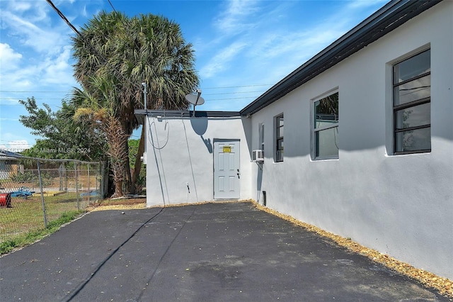 view of side of home featuring cooling unit