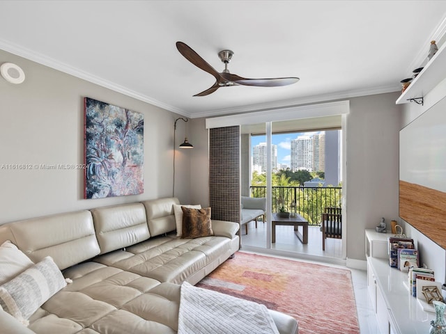 living room with ceiling fan and ornamental molding