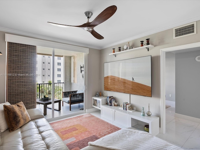 living room featuring ceiling fan and ornamental molding