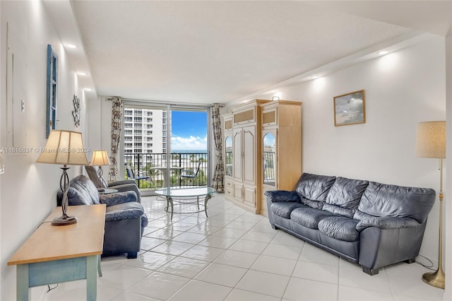 living room featuring floor to ceiling windows and light tile patterned floors