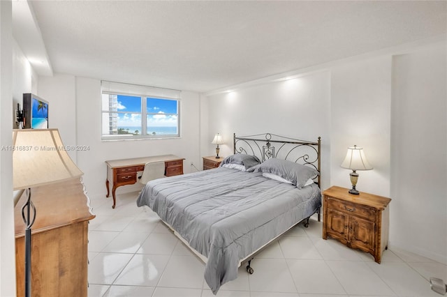 tiled bedroom with a textured ceiling