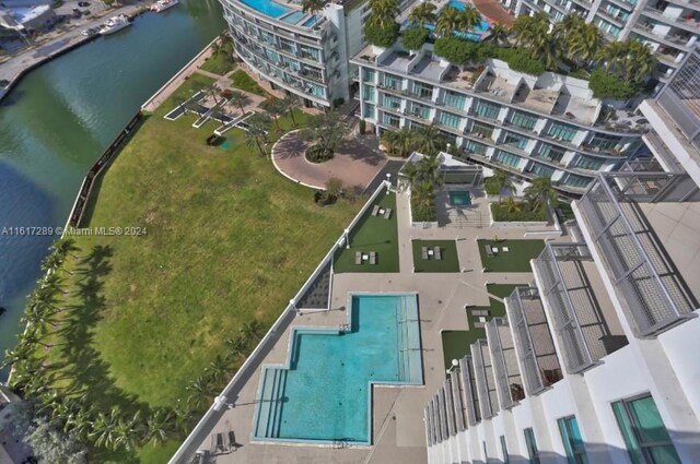 birds eye view of property with a water view