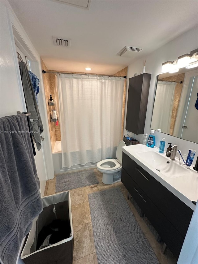 full bathroom featuring shower / tub combo with curtain, vanity, tile patterned flooring, and toilet