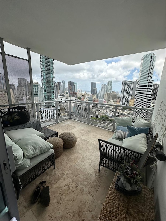 balcony with a view of city and an outdoor living space