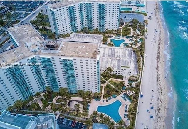 bird's eye view with a water view and a view of the beach