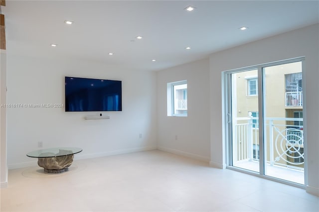 living room with tile patterned floors and plenty of natural light