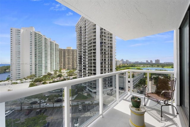 balcony featuring a water view