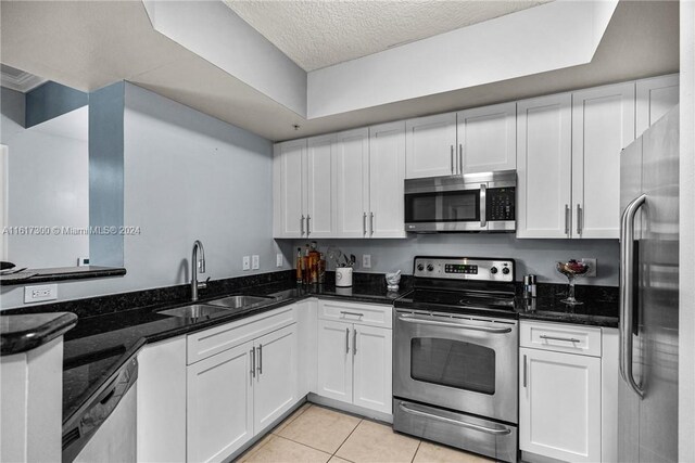 kitchen with white cabinetry, appliances with stainless steel finishes, and sink