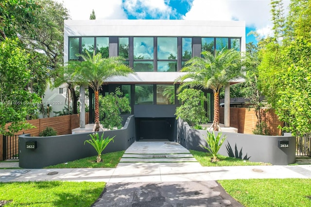 2832 Coconut Ave Unit 2832, Miami, FL 33133 - modern home featuring a fenced front yard and stucco siding