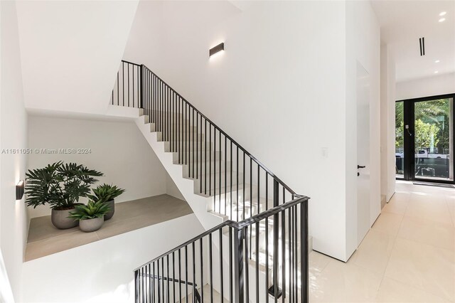 2832 Coconut Ave Unit 2832, Miami, FL 33133 - stairs featuring tile patterned flooring and recessed lighting