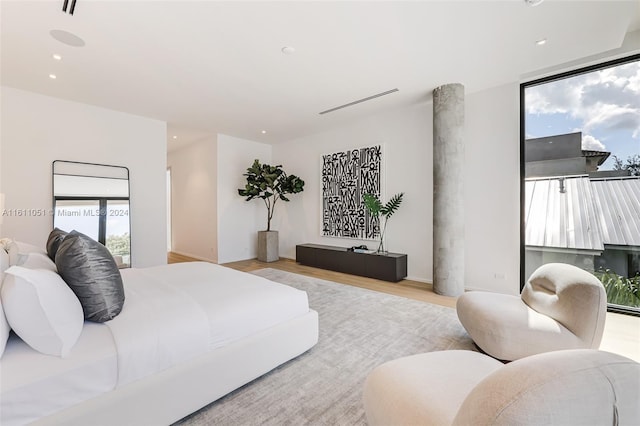 bedroom with light hardwood / wood-style flooring